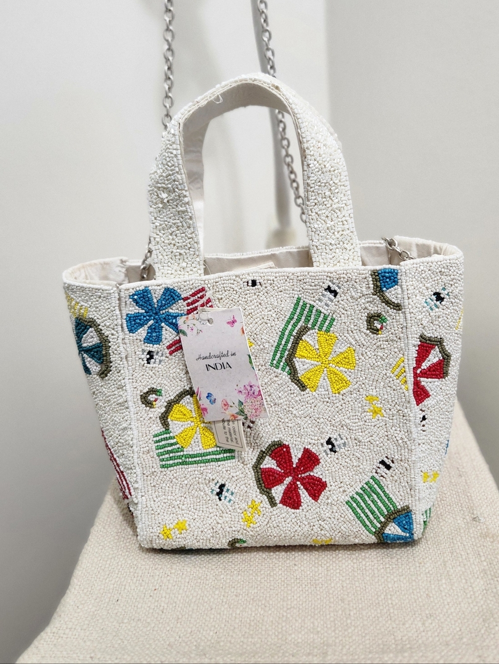 Handcrafted White Beaded Mini Tote with Multicolor Floral Motifs